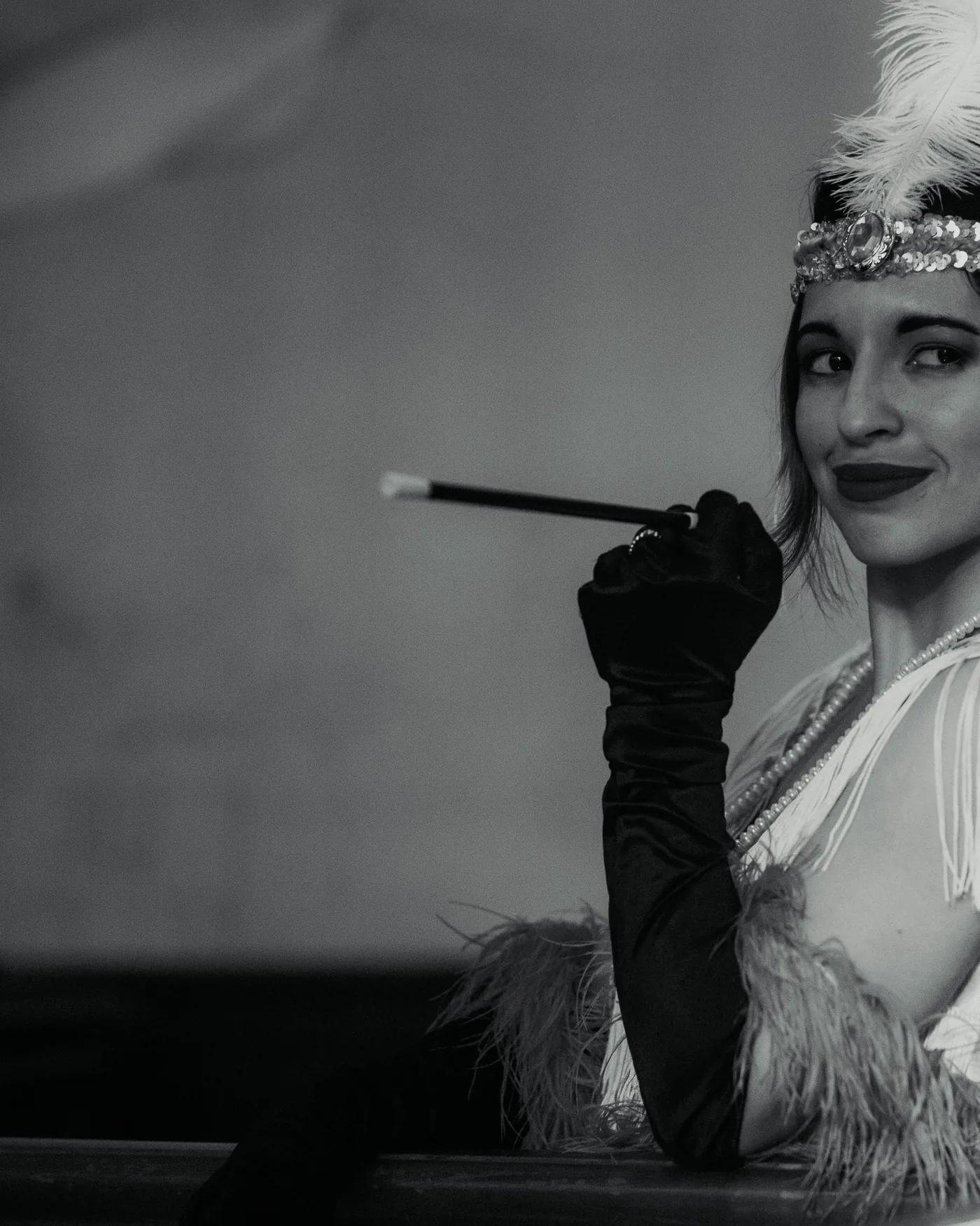 A black-and-white period-style portrait evoking 1920s Berlin cabaret